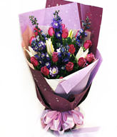 15 purple roses , lilies , delphinium
